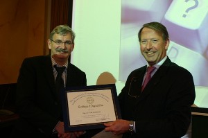Cdre. Schoonderbeek (r) hands a certificate of appreciation to Hans Loermans, senior advisor, BG-IVENT, at the meeting in February.